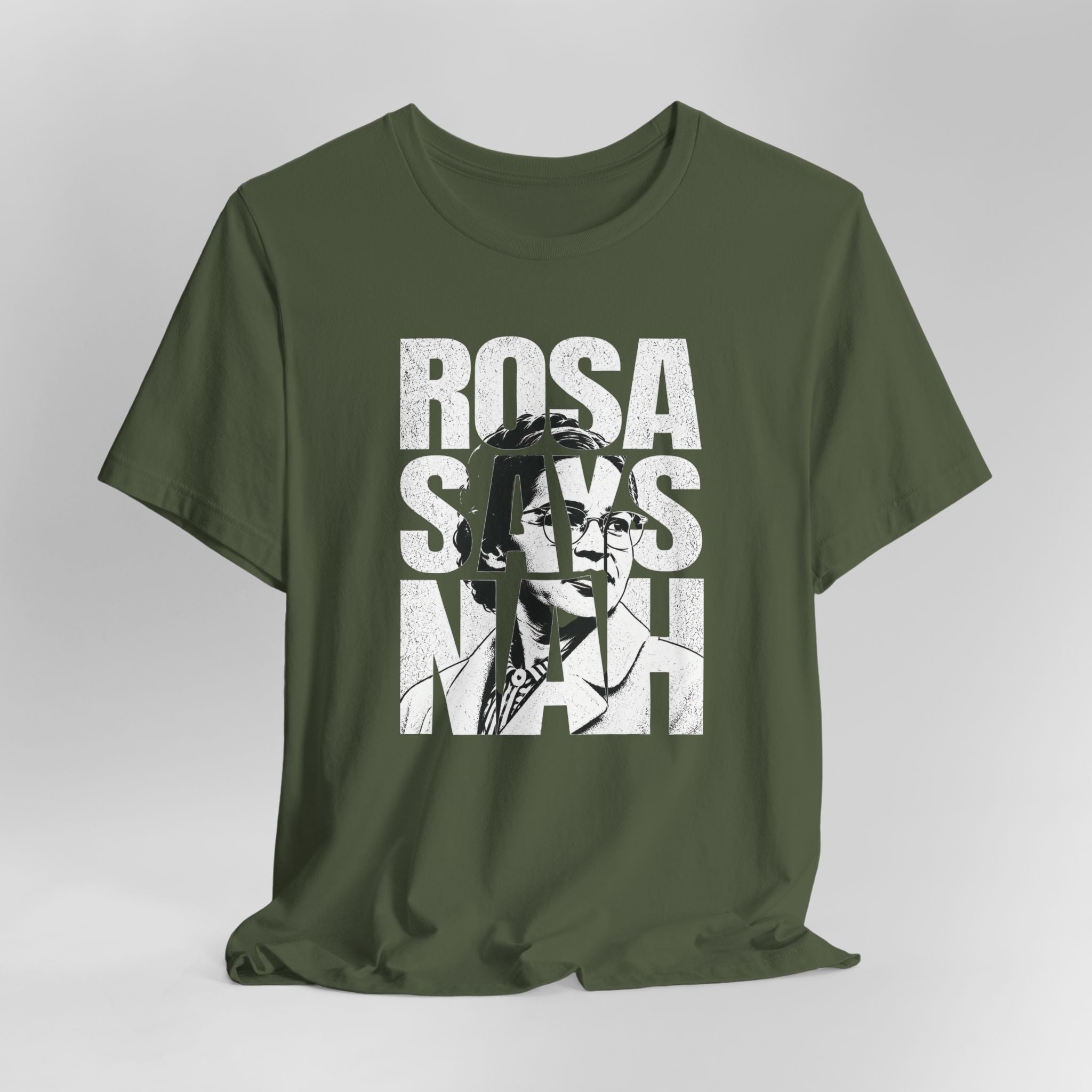 Green t-shirt with a graphic design of a woman's face and 'ROSA SAYS NAAH' text on a white background