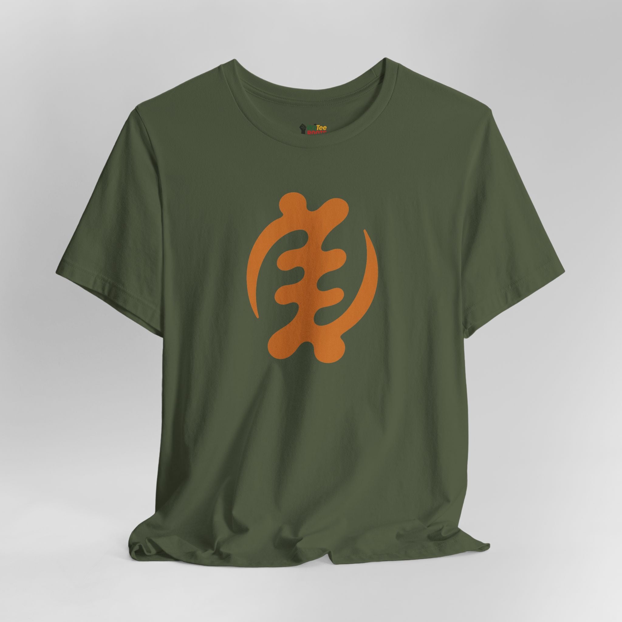 Green t-shirt with orange symbol on a gray background