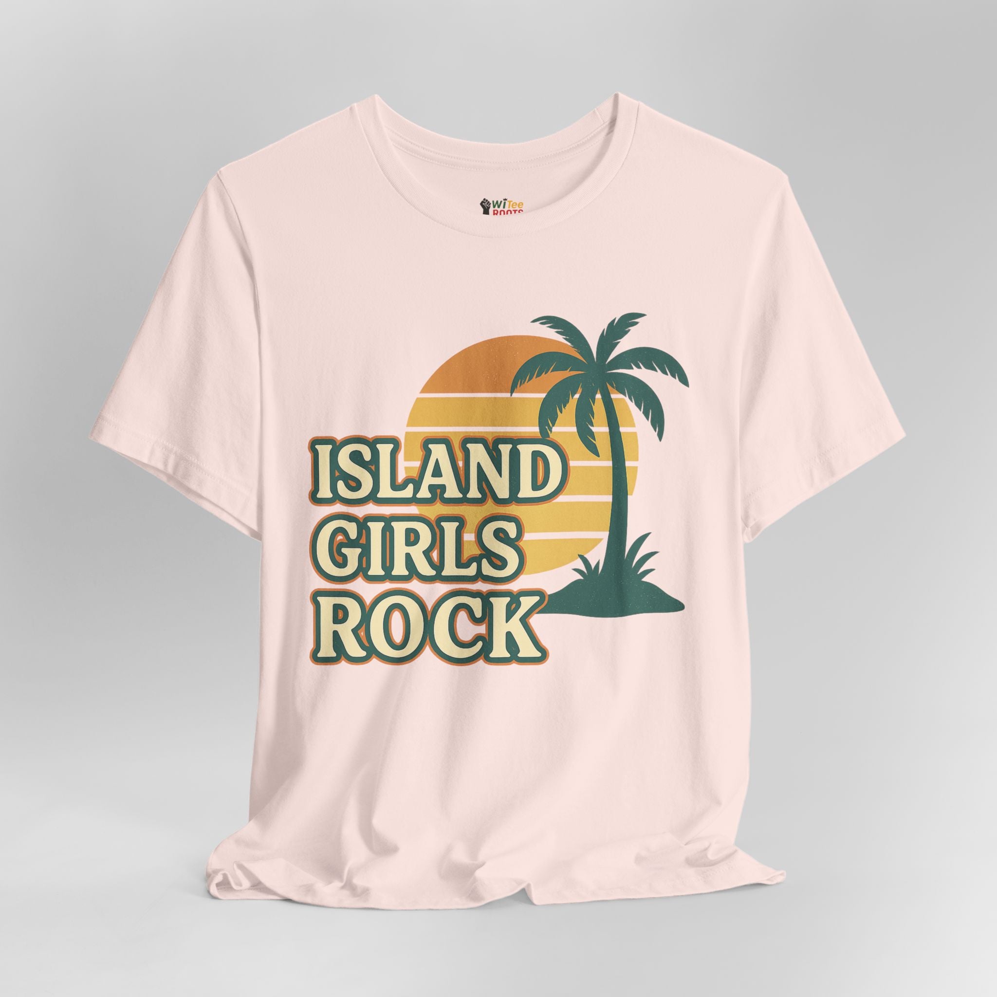 Pink t-shirt with 'Island Girls Rock' text and palm tree design on a gray background