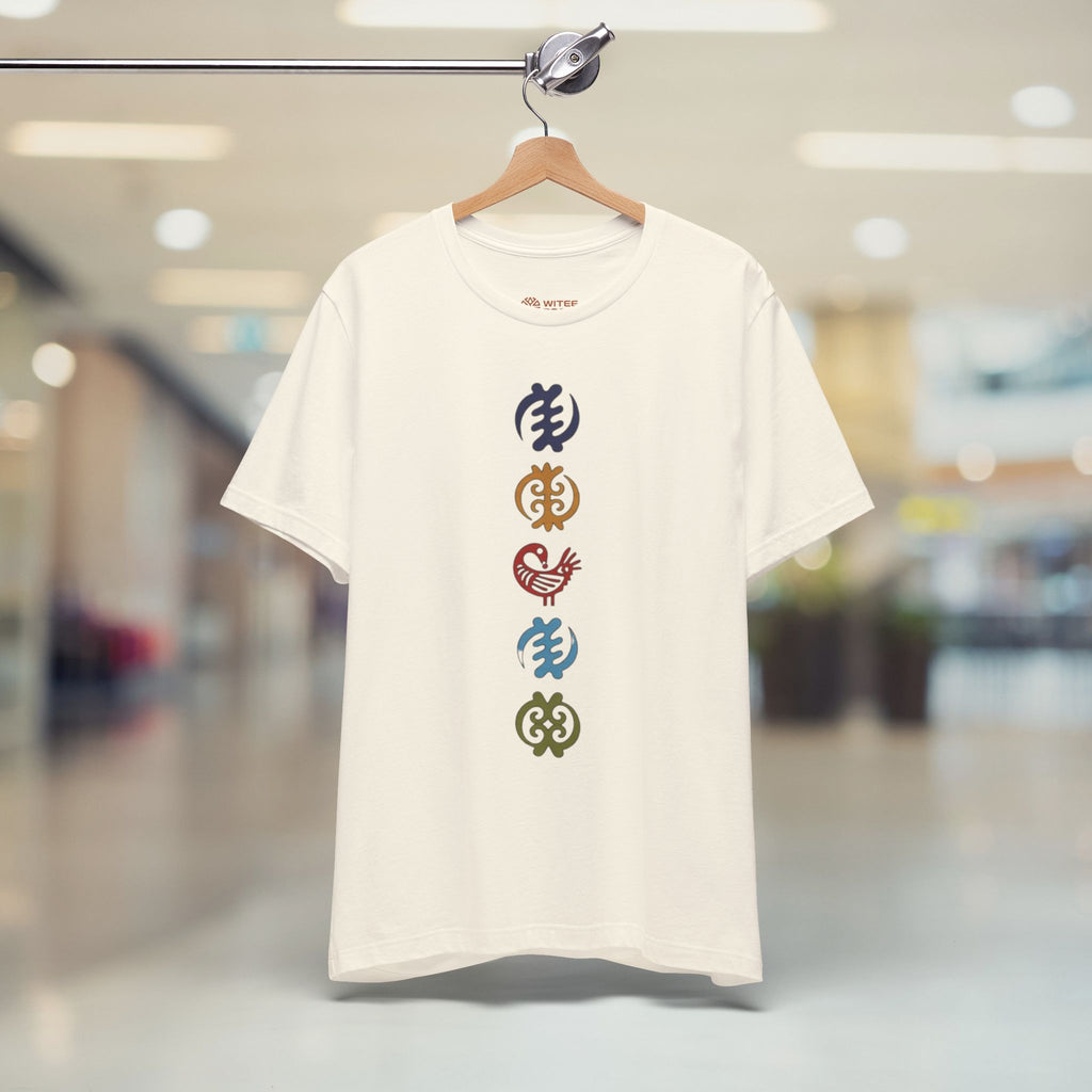 Sand t-shirt with colorful symbols on a hanger in a store setting