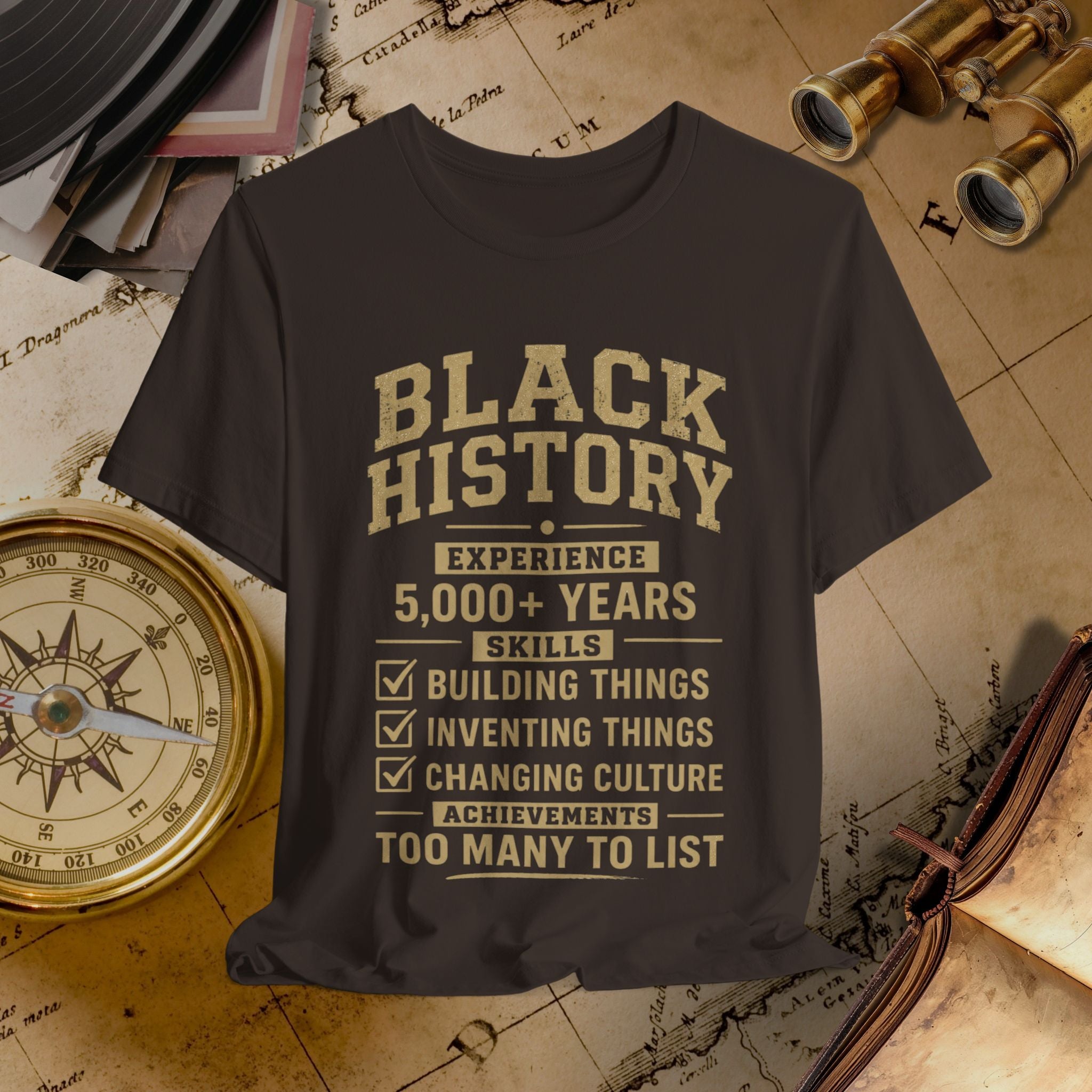 Brown t-shirt with 'Black History' text on a vintage map background