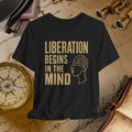 Black t-shirt with 'Liberation Begins in the Mind' text and a face outline on a vintage map background.