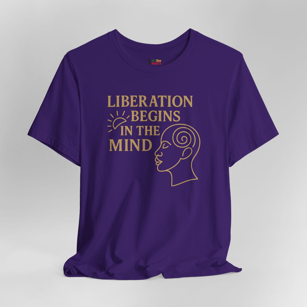 Purple t-shirt with 'Liberation Begins in the Mind' text and graphic on a gray background