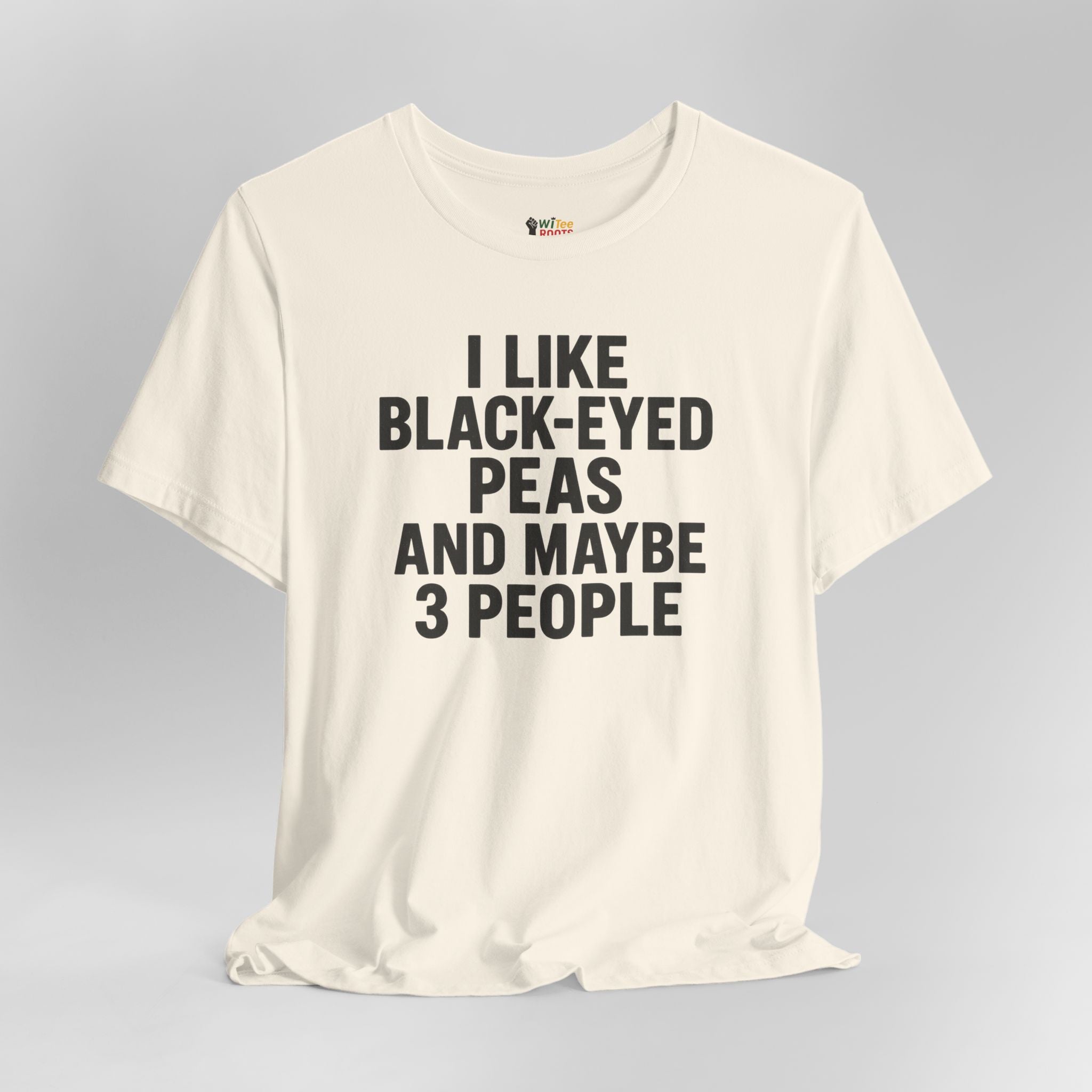 Natural t-shirt with text 'I LIKE BLACK-EYED PEAS AND MAYBE 3 PEOPLE' on a gray background