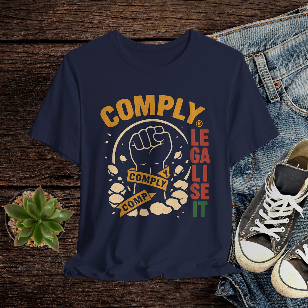 Navy blue t-shirt with graphic design featuring a fist and text on a wooden surface with jeans and sneakers.