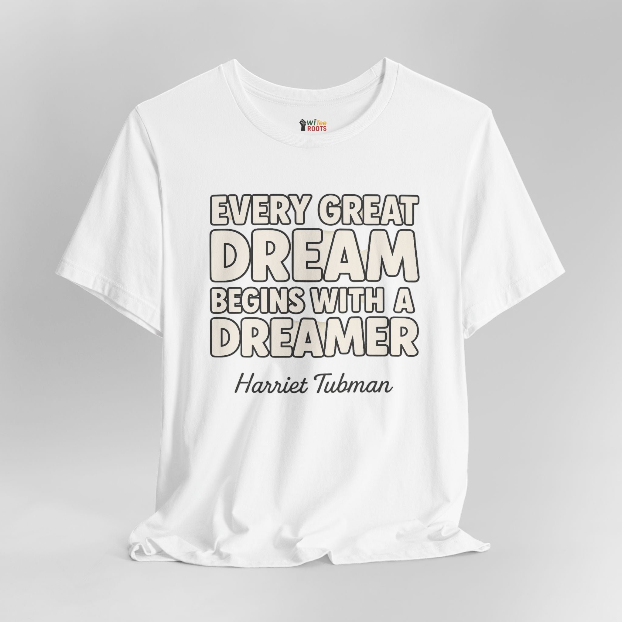White t-shirt with motivational quote on a gray background