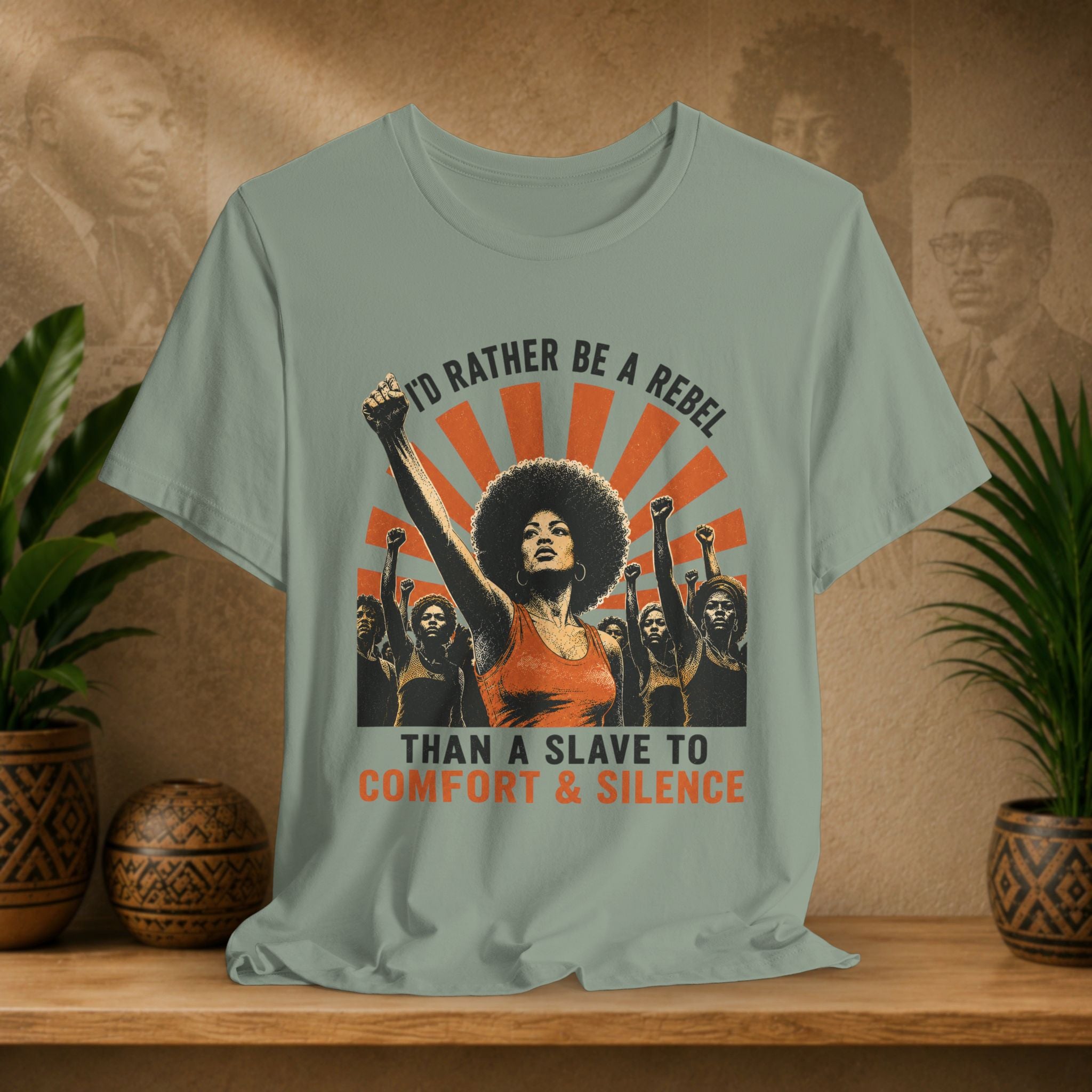 T-shirt with graphic design and text on a wooden surface with plants and decorative items.