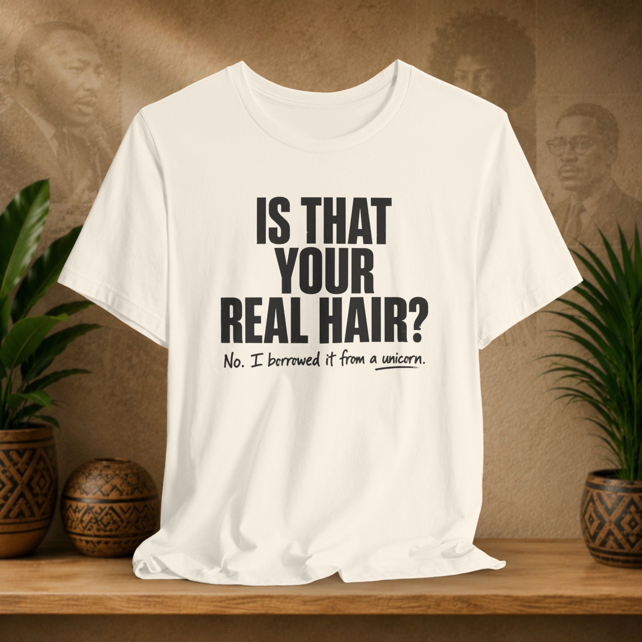 Beige t-shirt with humorous text on a wooden shelf with plants and a textured wall background