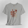 Gray t-shirt with humorous graphic and text on a light gray background