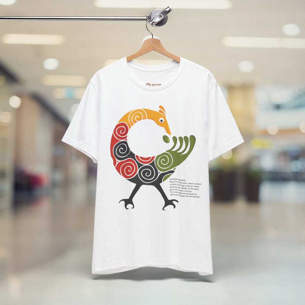 White t-shirt with a colorful bird design on a hanger in a store.
