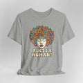 Gray t-shirt with a colorful butterfly design and text on a light gray background