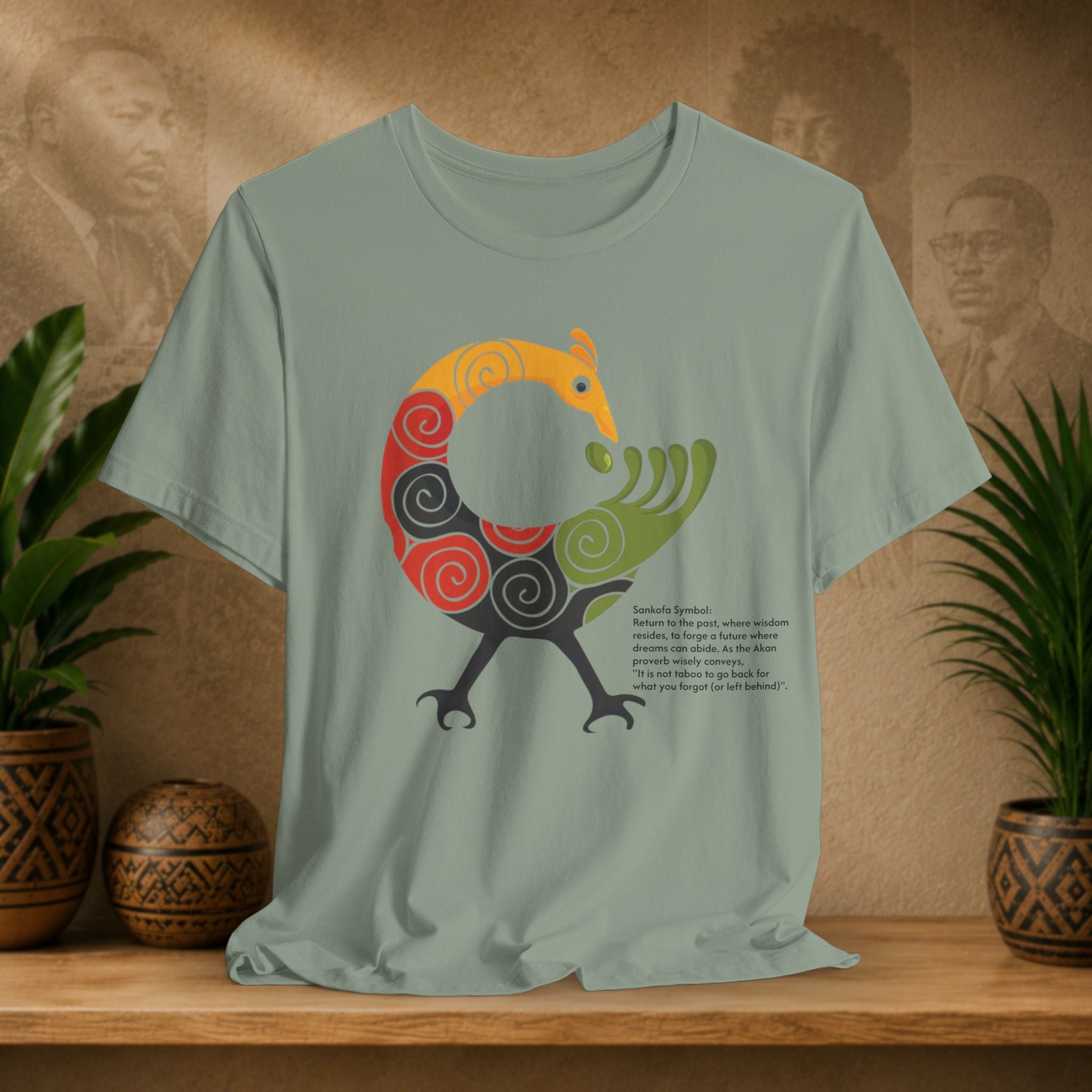 T-shirt with a colorful graphic design on a wooden surface with plants and a textured wall in the background
