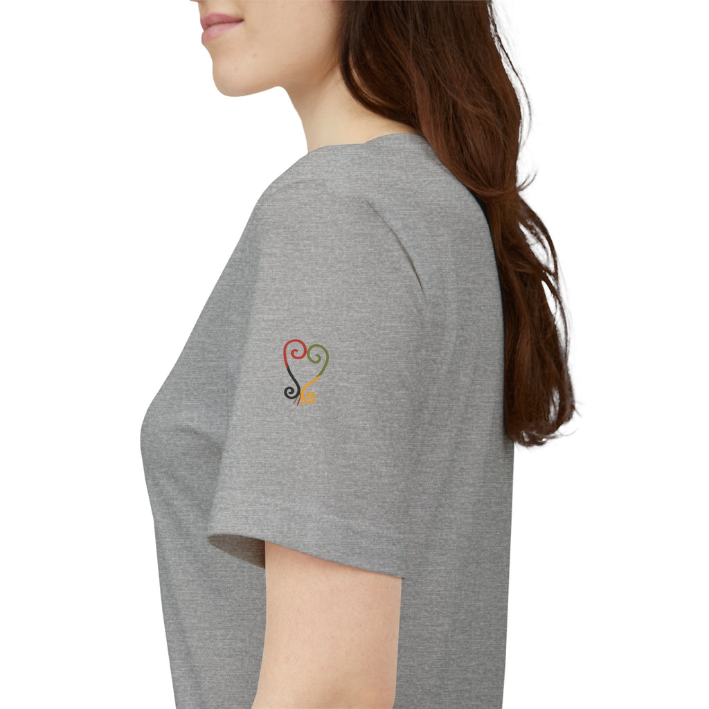 Person wearing a gray t-shirt with a colorful heart design on the sleeve against a white background