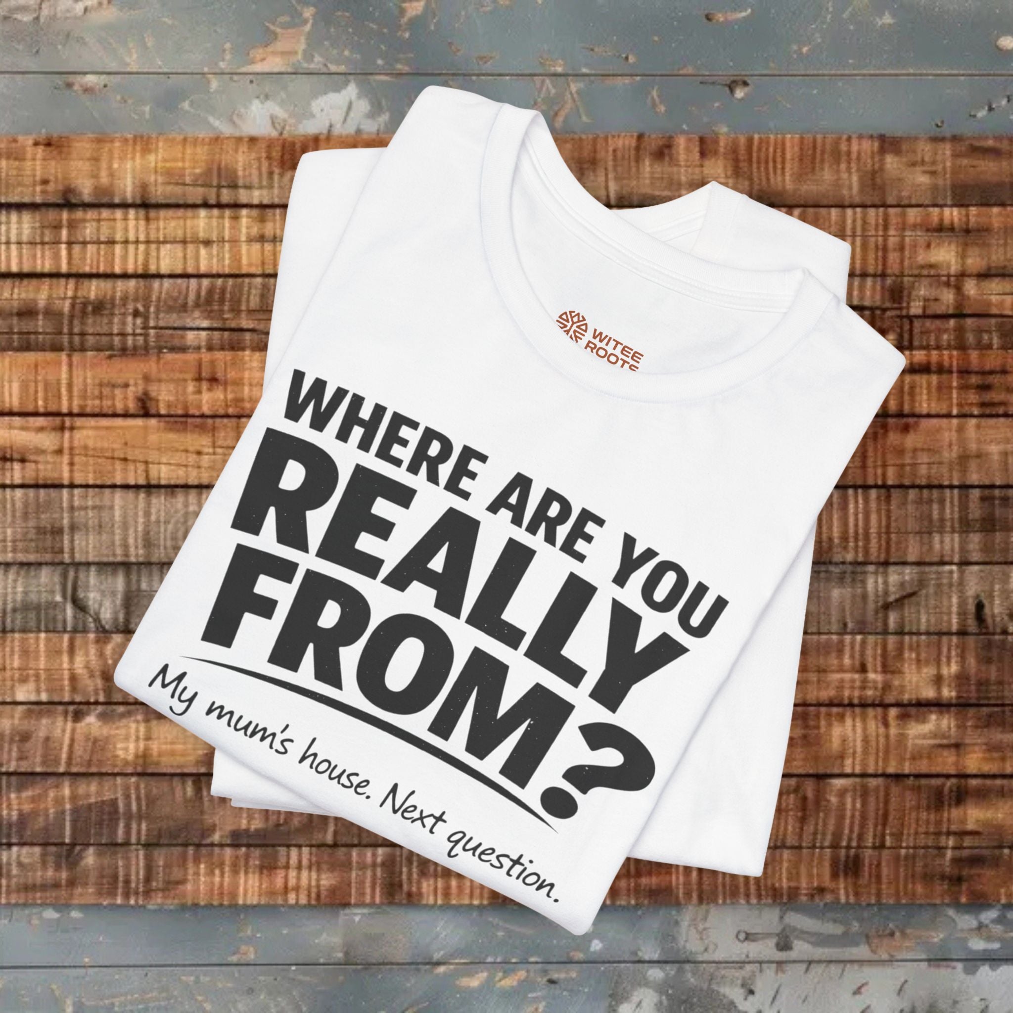 White t-shirt with text on a wooden surface