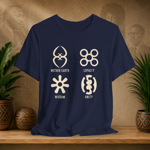 Navy blue t-shirt with white symbols and text on a wooden surface with plants and decorative items.