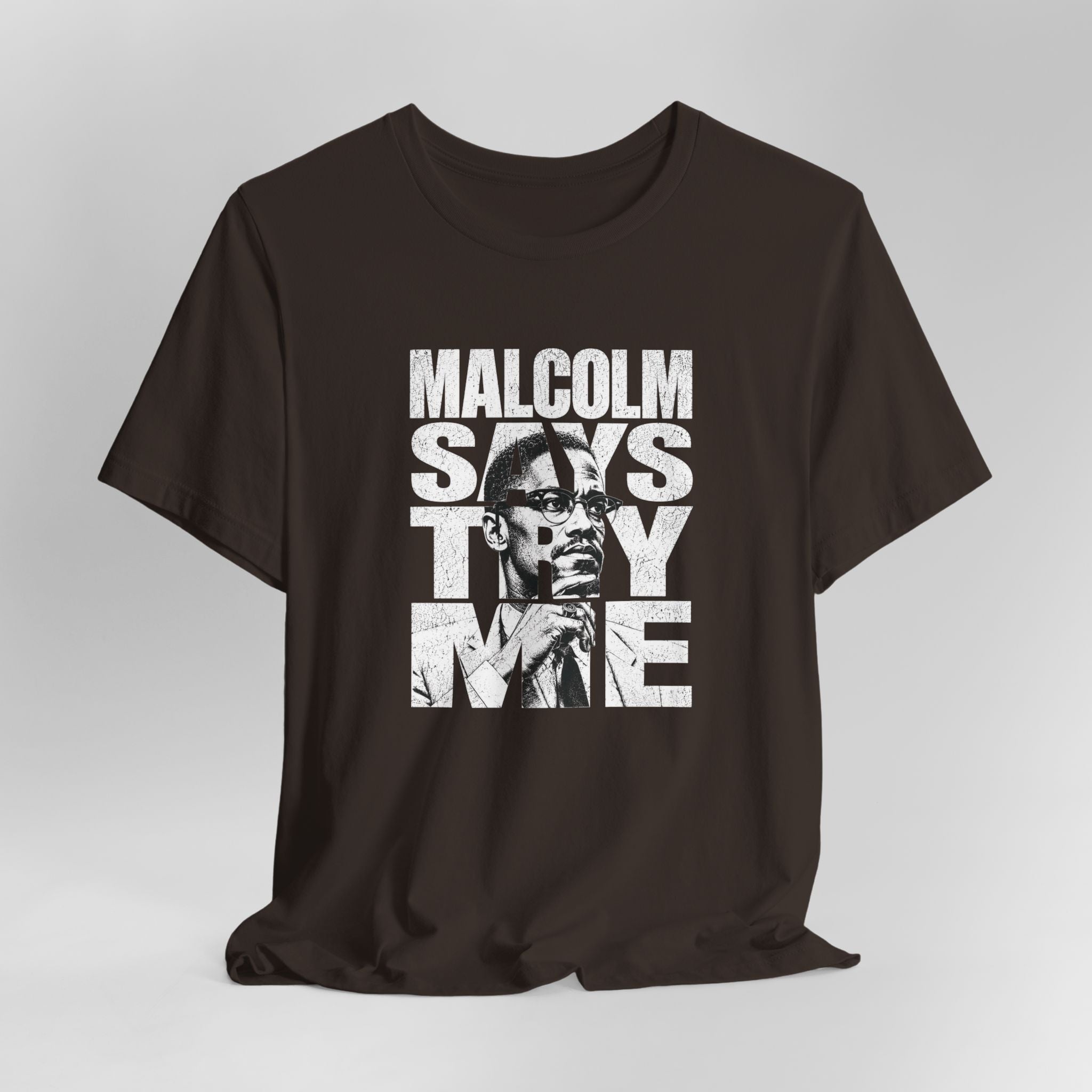 Brown  t-shirt with graphic design and text on a gray background