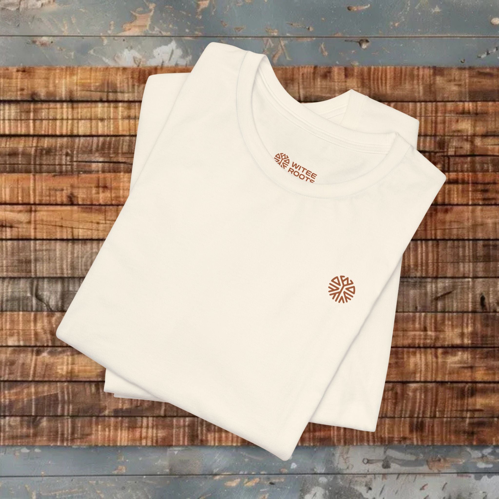White towels with a logo on a wooden surface