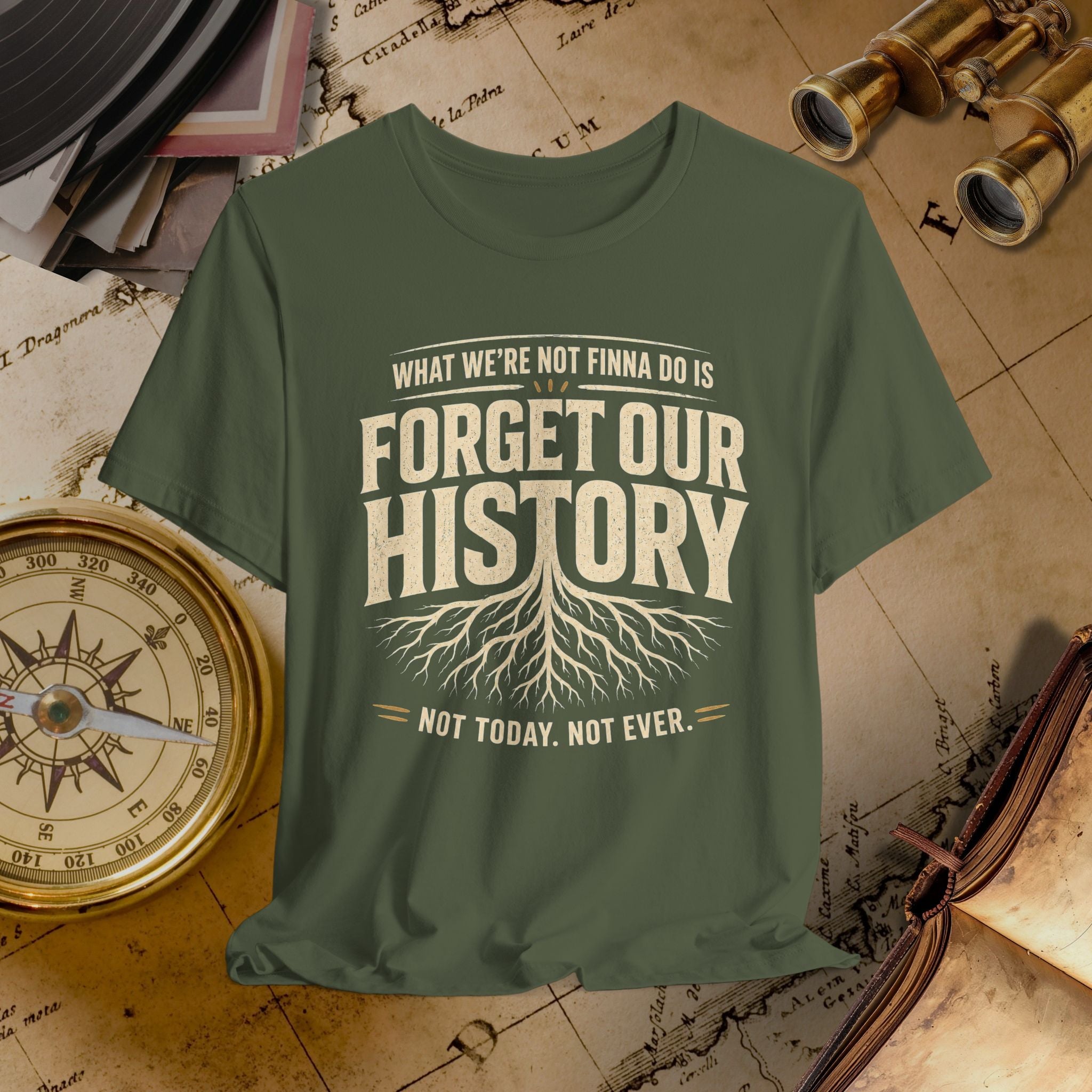 Green t-shirt with 'Forget Our History' text on a vintage map background