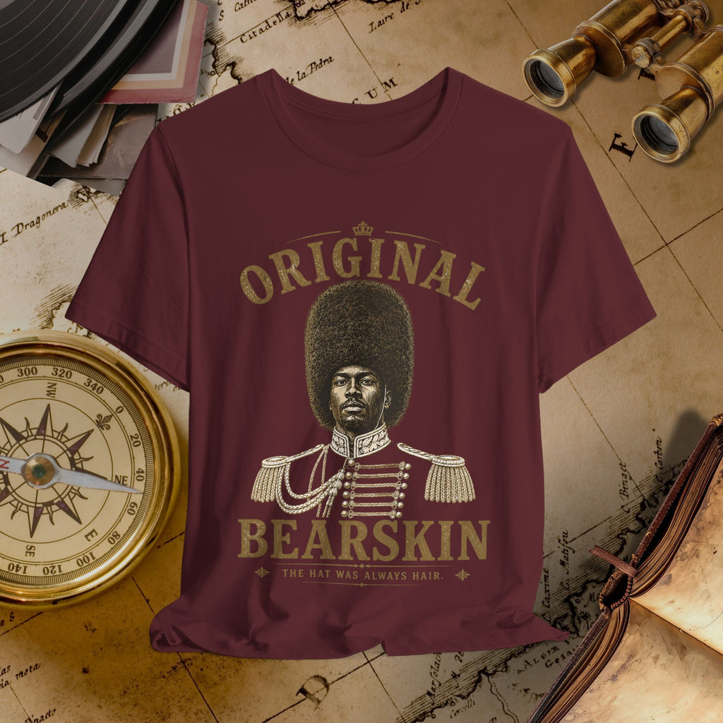 Maroon t-shirt with a graphic of a person in uniform and text 'Original Bearskin' on a vintage background.