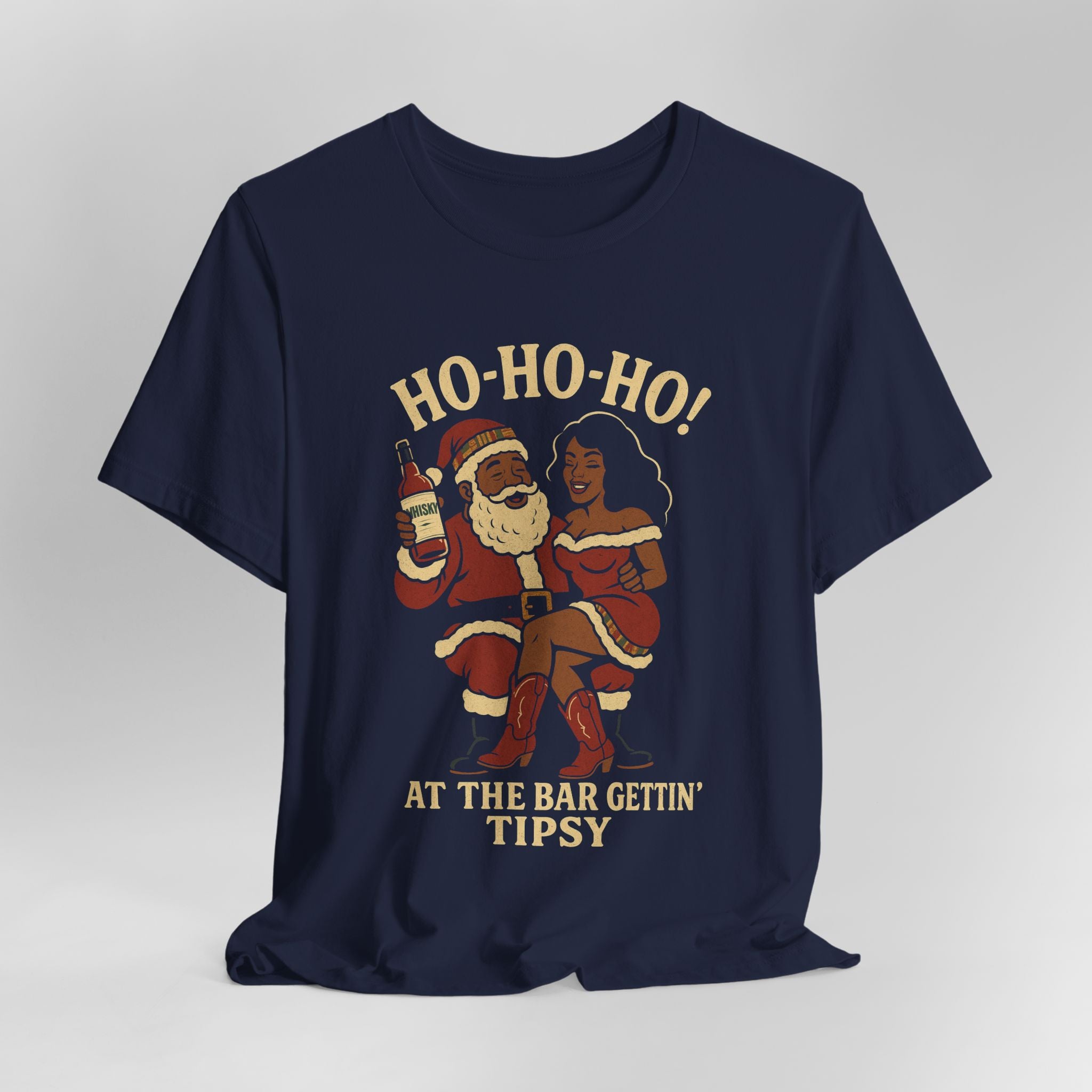 Navy blue t-shirt with a graphic of Santa Claus and a woman holding a bottle, with text 'HO-HO-HO! AT THE BAR GETTIN' TIPSY' on a gray background.
