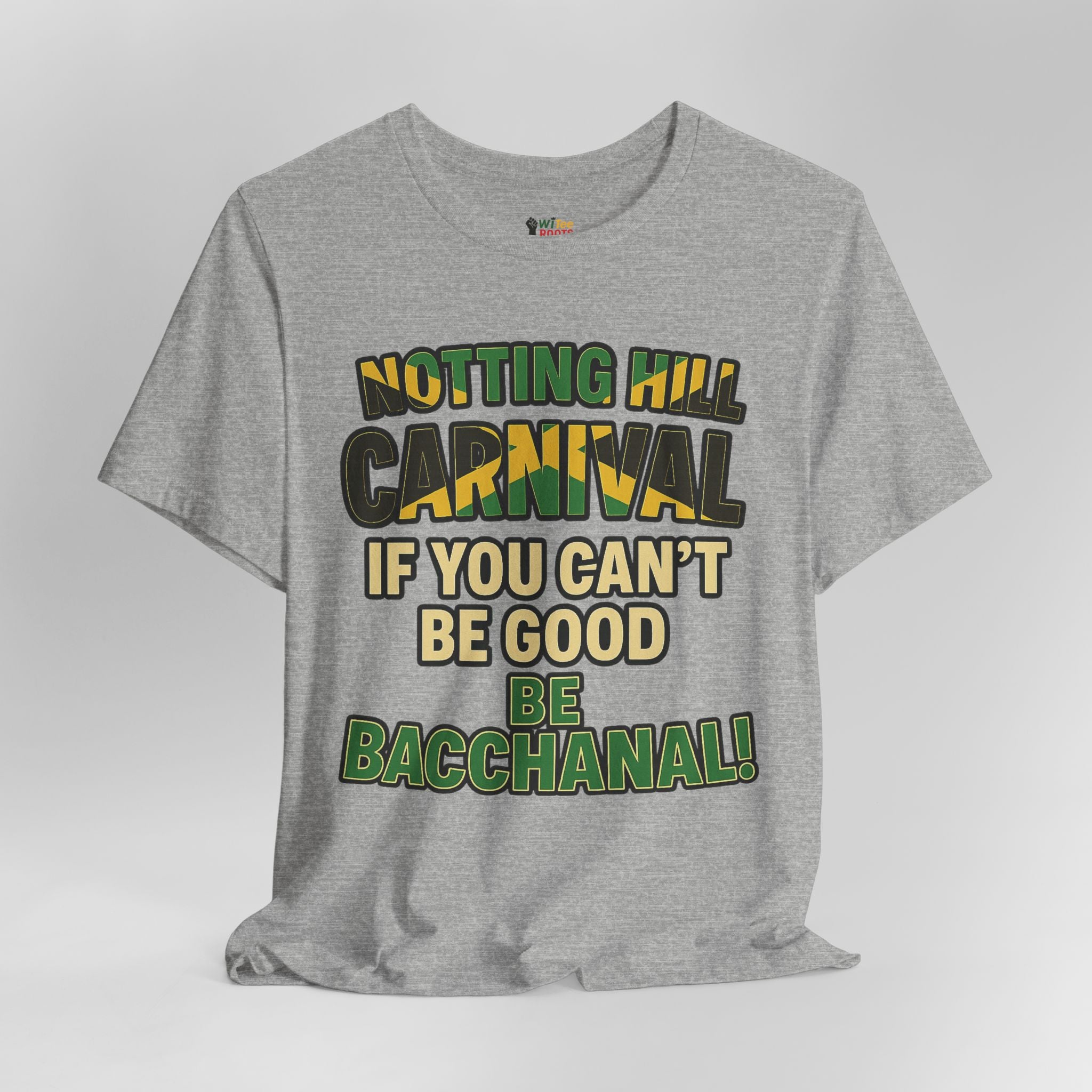 Gray t-shirt with colorful text 'Notting Hill Carnival If You Can't Be Good Be Bacchanal' on a light gray background