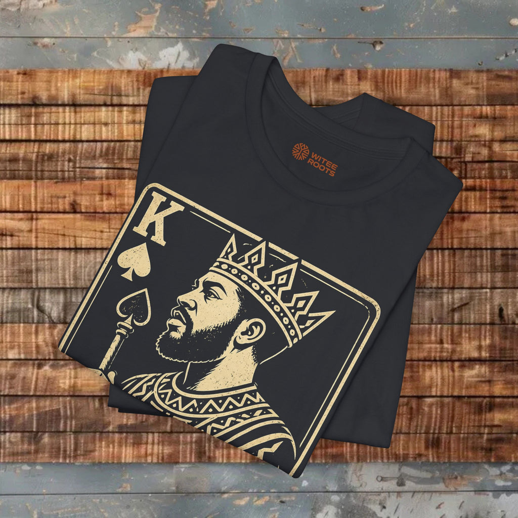 Black t-shirt with a graphic design of a king on a wooden surface