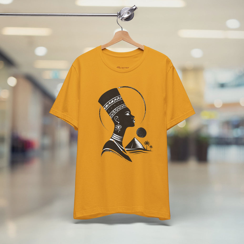 Yellow t-shirt with a black graphic design of a woman on a hanger in a store.