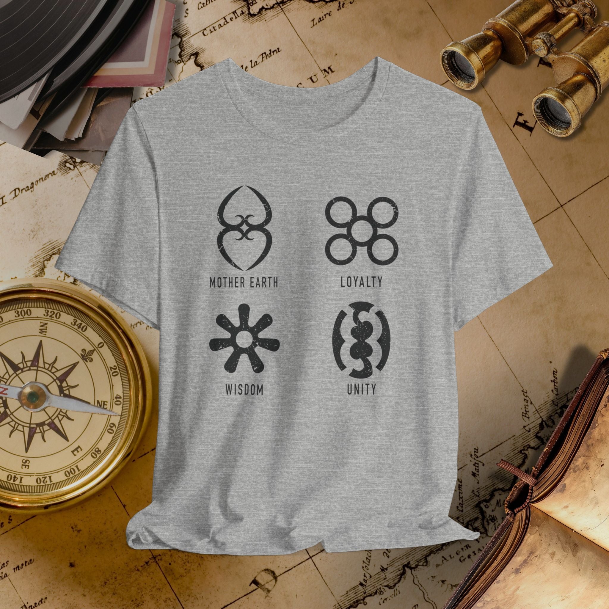 Gray t-shirt with symbols and text on a vintage map background