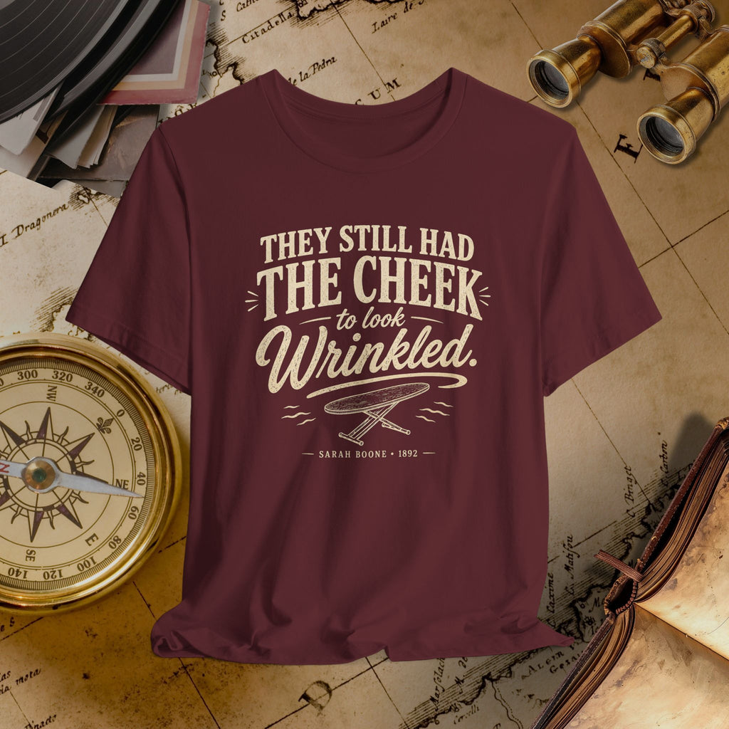 Maroon t-shirt with white text on a vintage map background