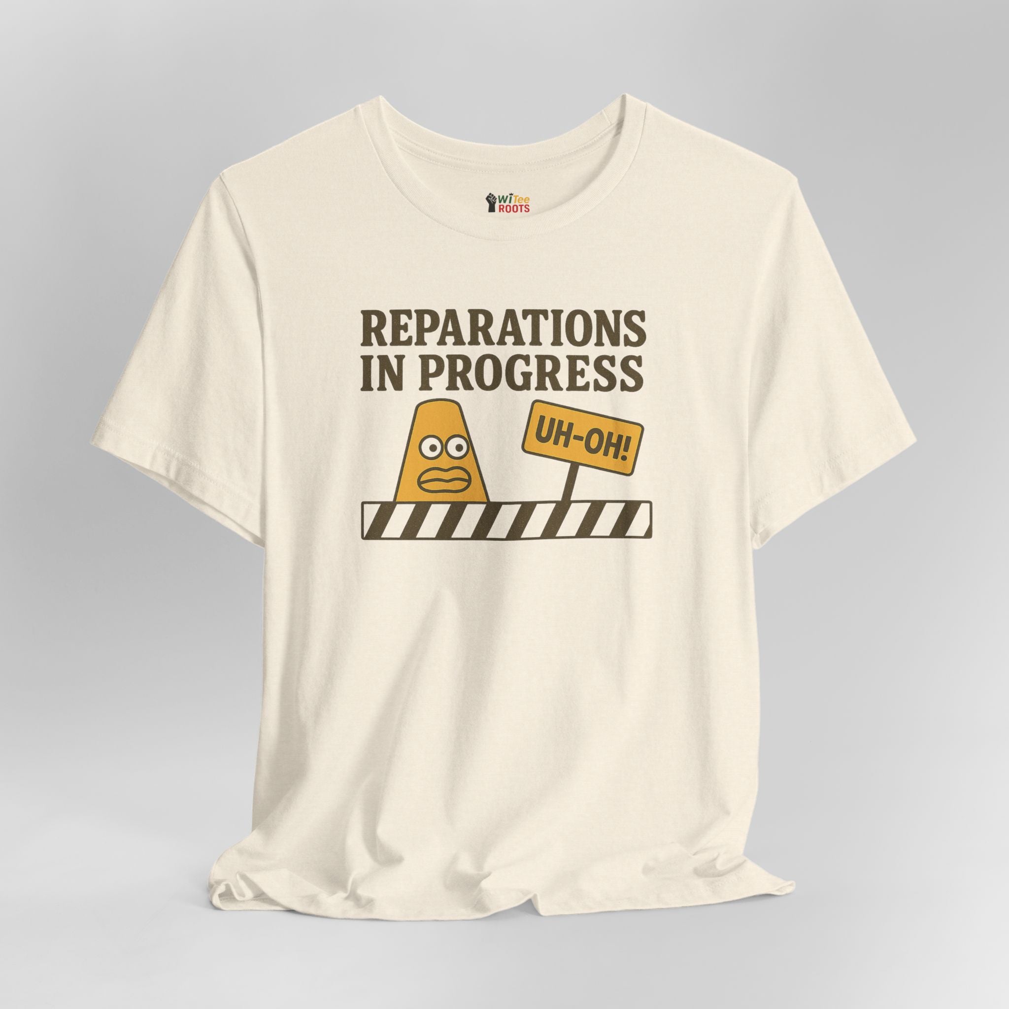 White t-shirt with graphic design and text 'Reparations in Progress' on a gray background