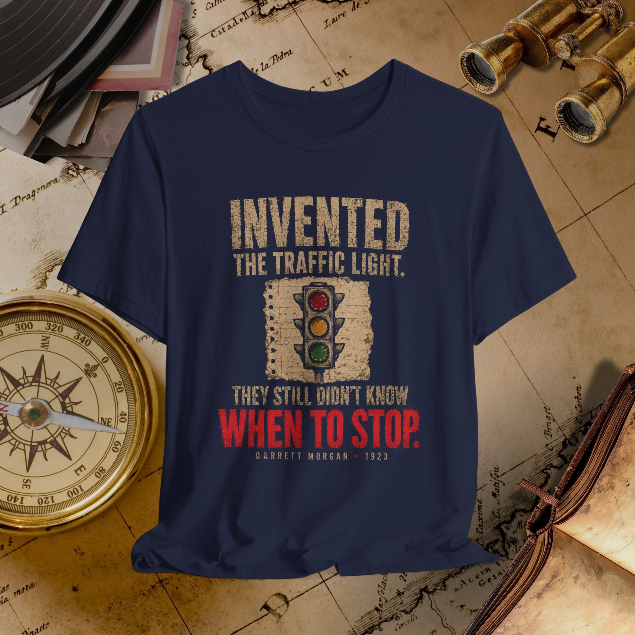 Navy blue t-shirt with vintage-style graphic and text on a historical map background