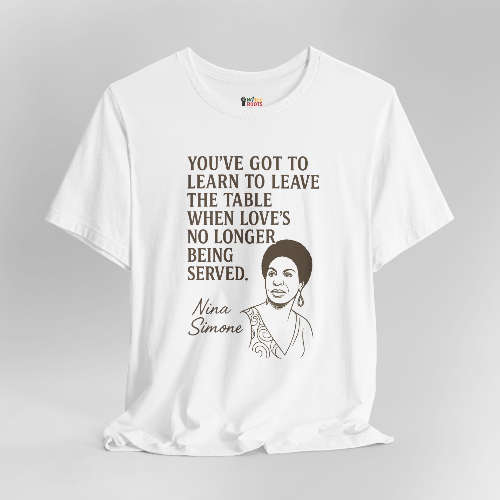 White t-shirt with Nina Simone quote and portrait on a gray background