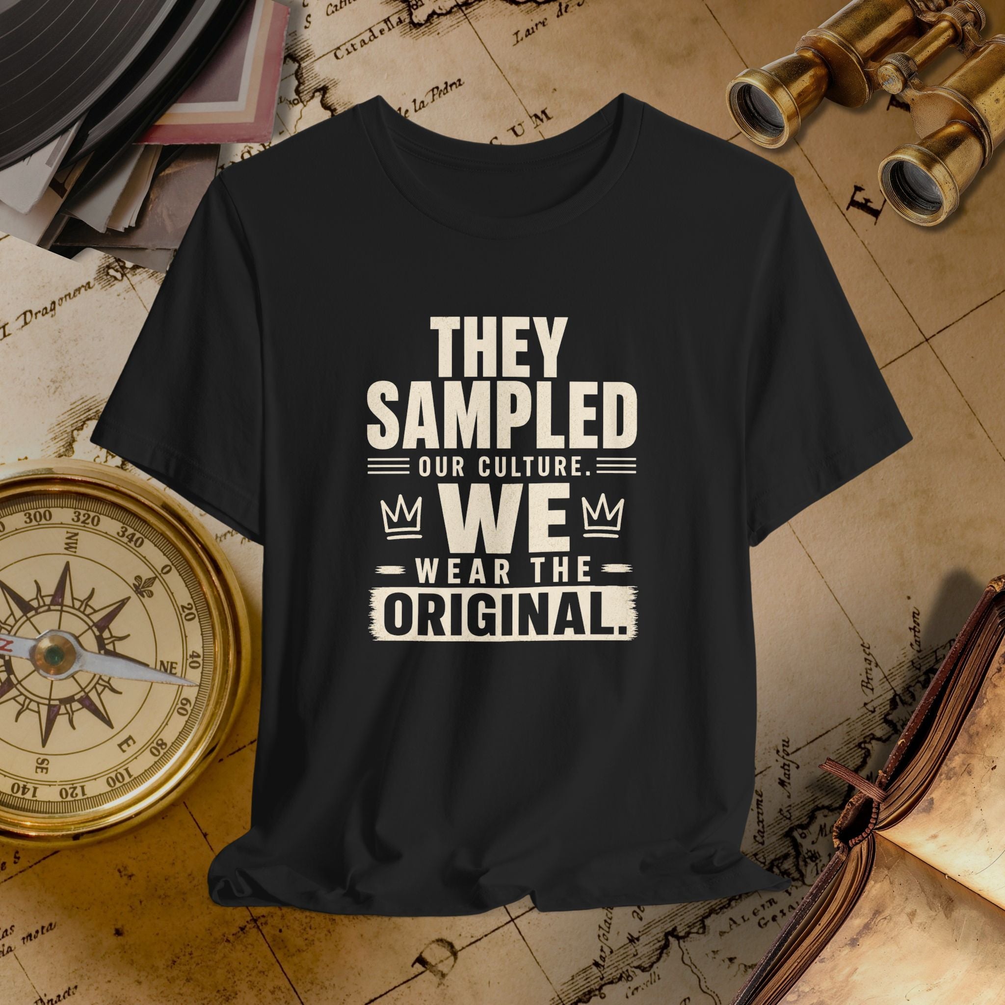 Black t-shirt with white text on a vintage map background