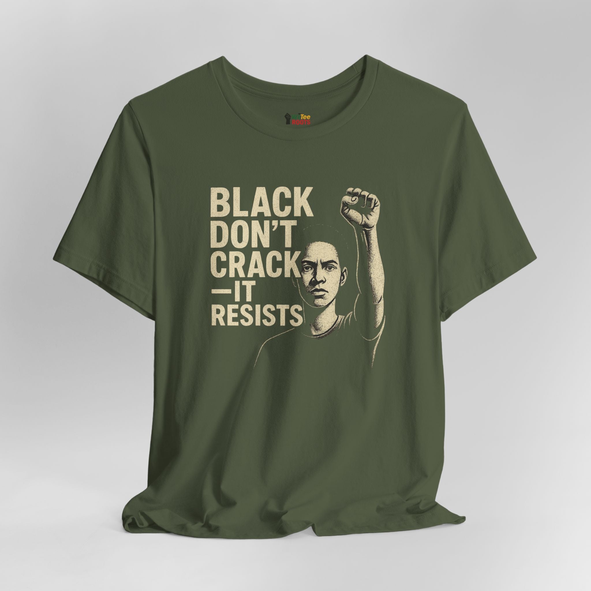 Green t-shirt with graphic and text 'Black Don't Crack It Resists' on a gray background