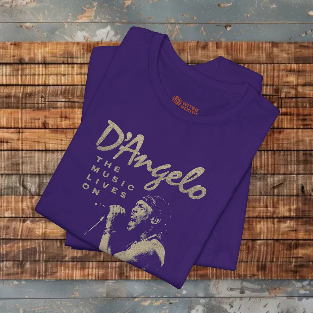 Folded purple t-shirt with 'D'Angelo' text and graphic on a wooden surface