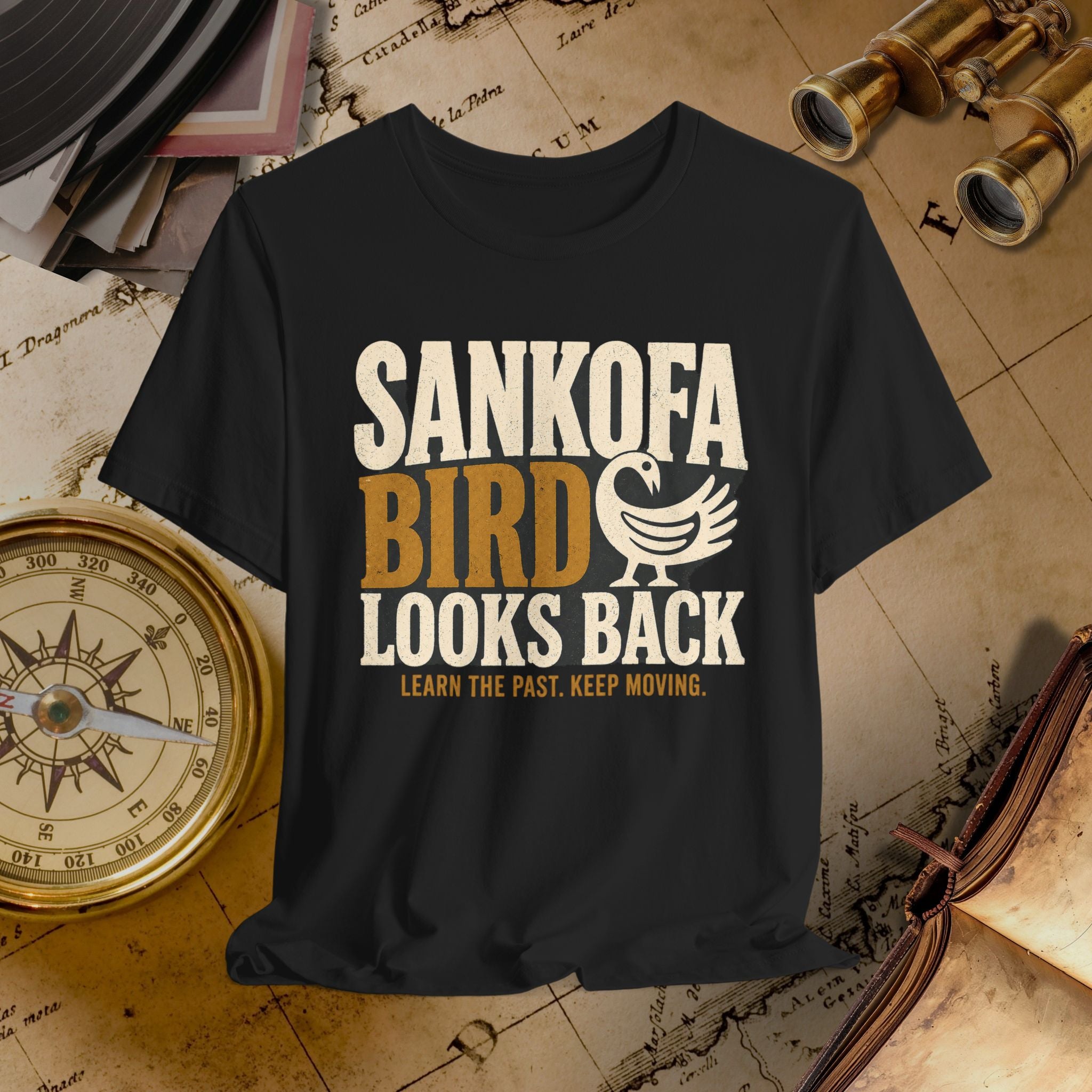 Black t-shirt with 'SANKOFA BIRD' text on a vintage map background