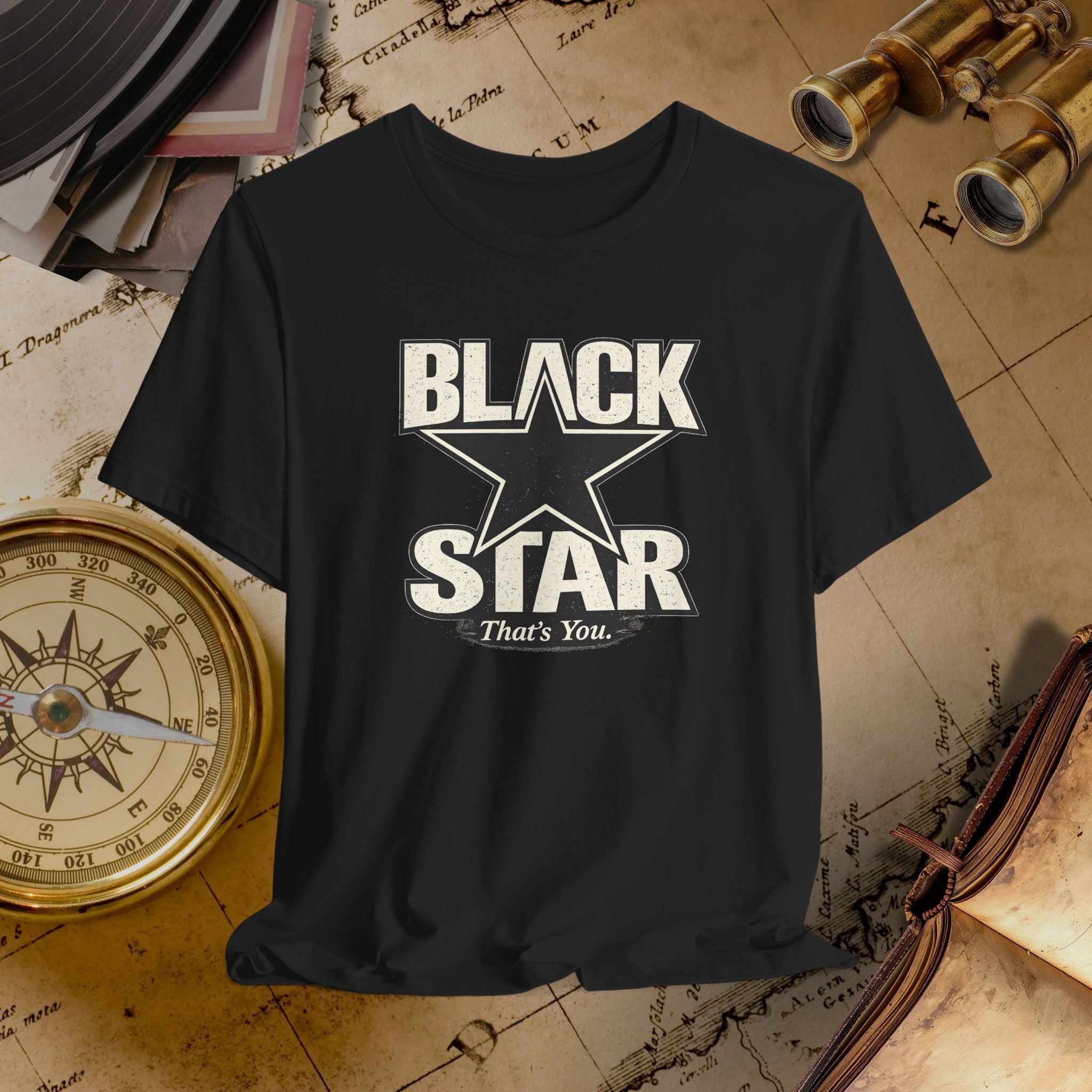 Black t-shirt with 'Black Star That's You' design on a vintage map background