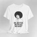 White t-shirt with a graphic of a woman with an afro and text 'No Justice No Peace No Quiet' on a gray background