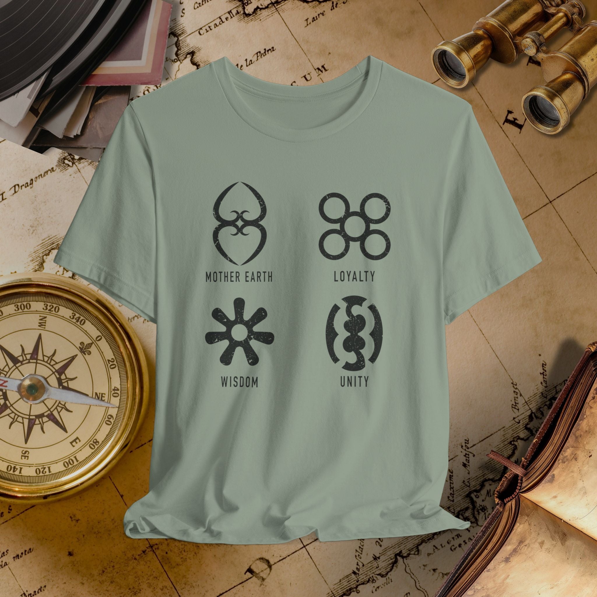 Light green t-shirt with symbols and text on a vintage map background