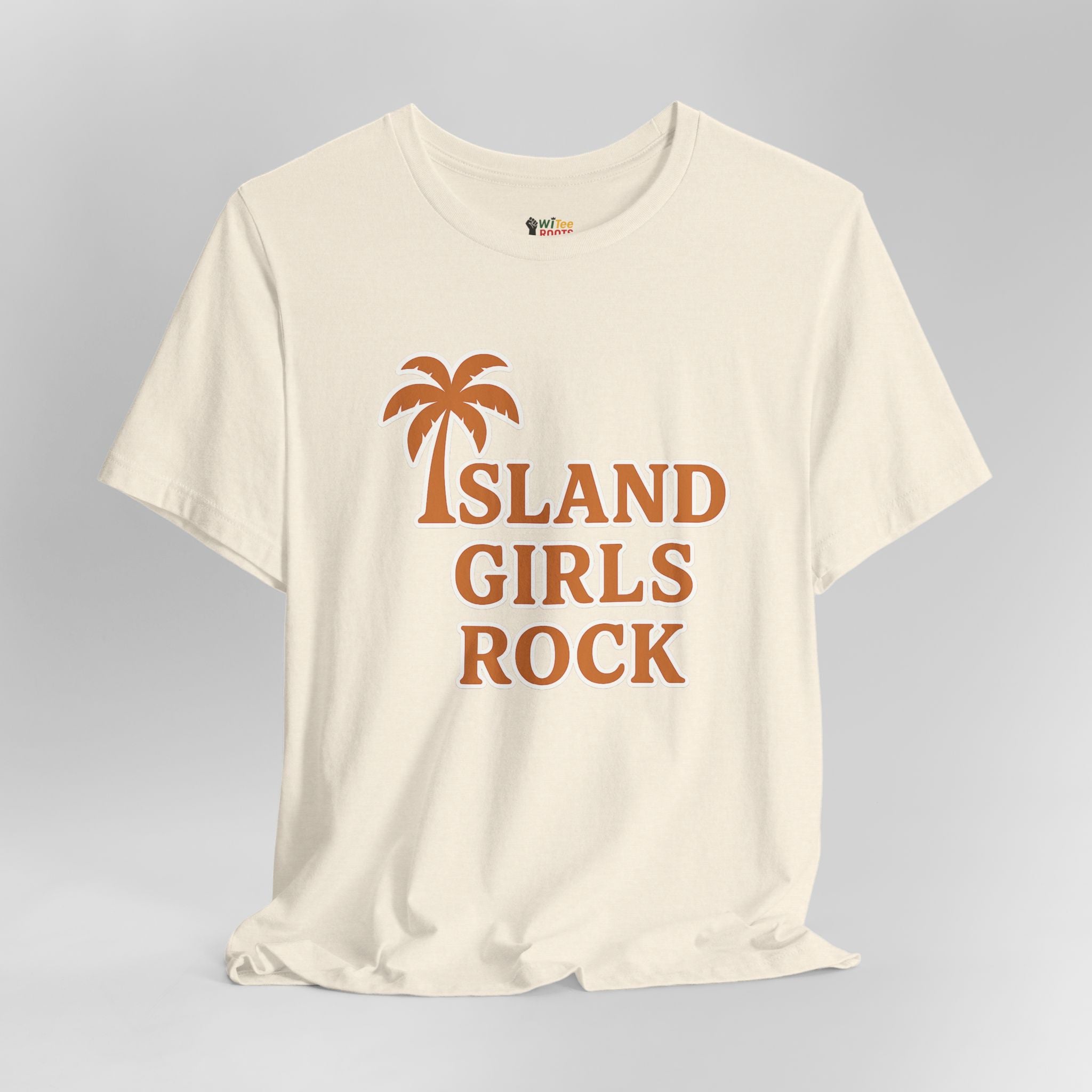 Beige t-shirt with 'Island Girls Rock' text and palm tree graphic on a gray background