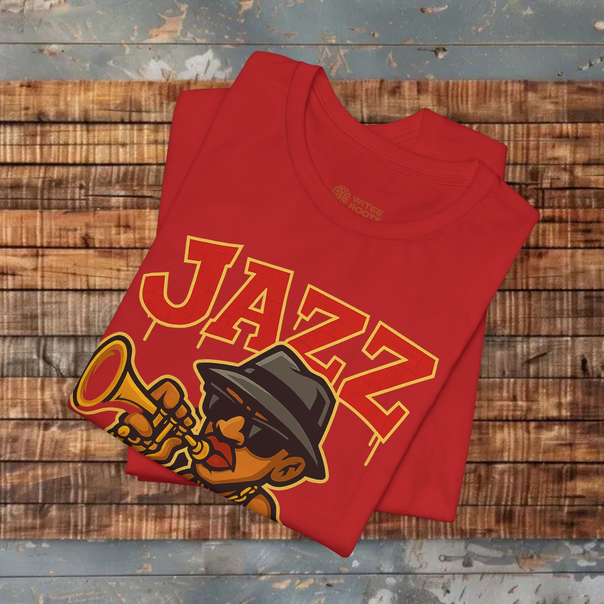Red t-shirt with 'JAZZ' design on a wooden surface