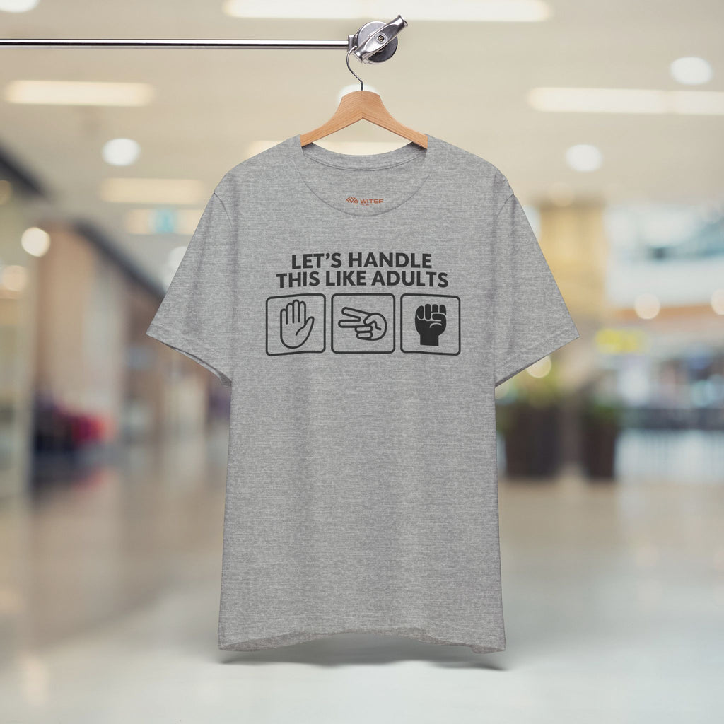 Gray t-shirt with text and icons on a hanger in a store setting