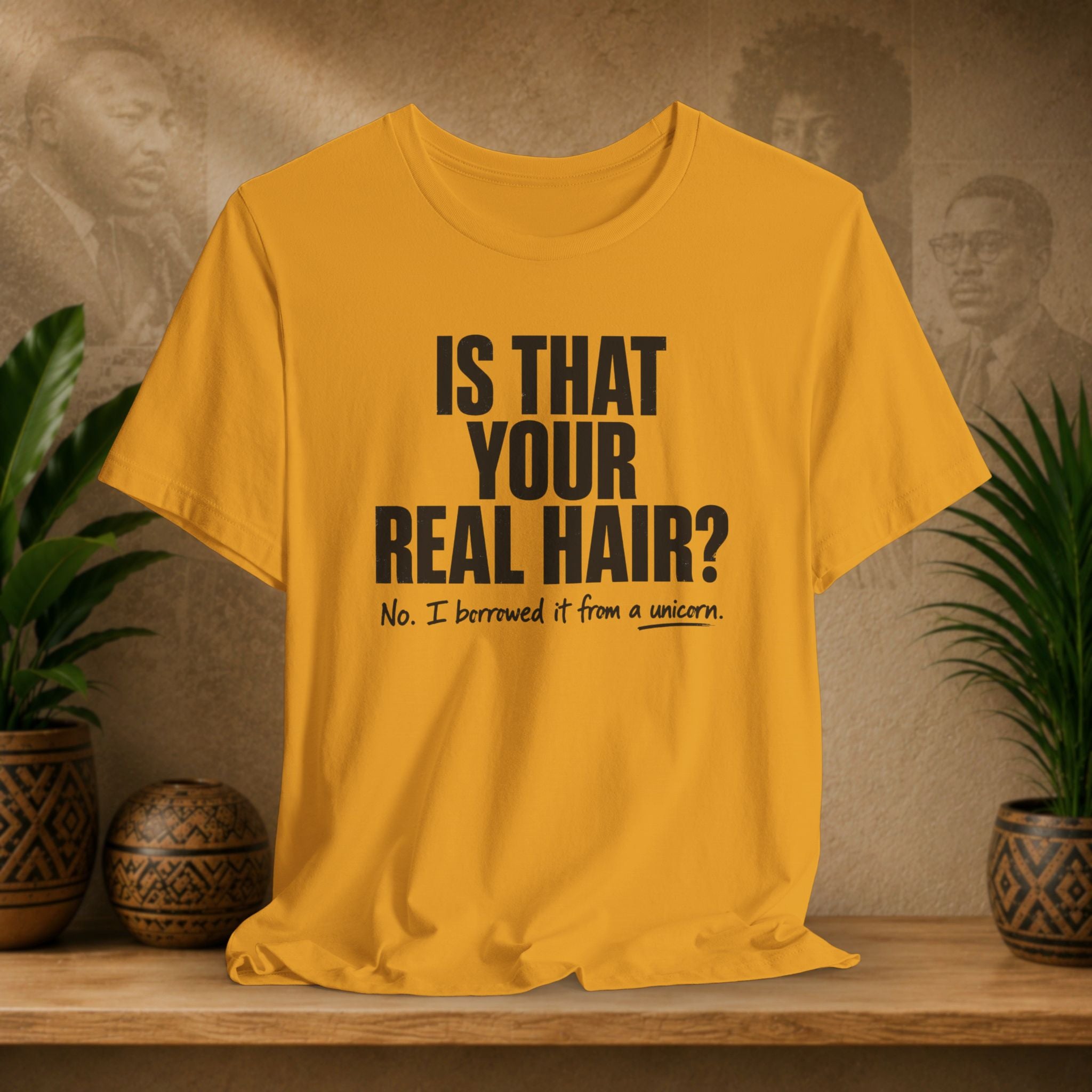 Yellow t-shirt with humorous text on a wooden surface with plants and decorative items.