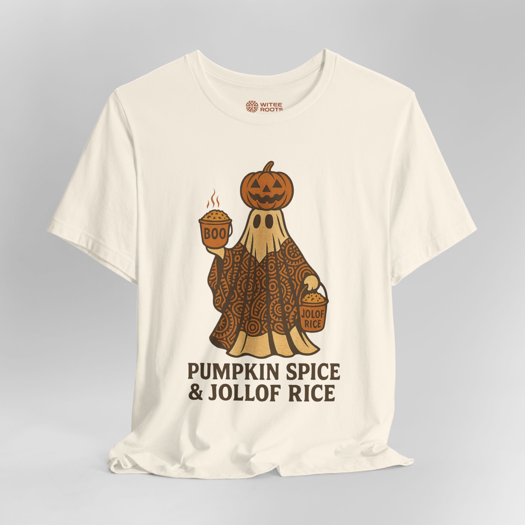 An off-white short-sleeve t-shirt with a graphic of a ghost in a patterned robe holding a cup of pumpkin spice latte and a bucket, with the text 'PUMPKIN SPICE & JOLLOF RICE' underneath. The inner neck label shows the brand 'NOT YOUR SIZE'.