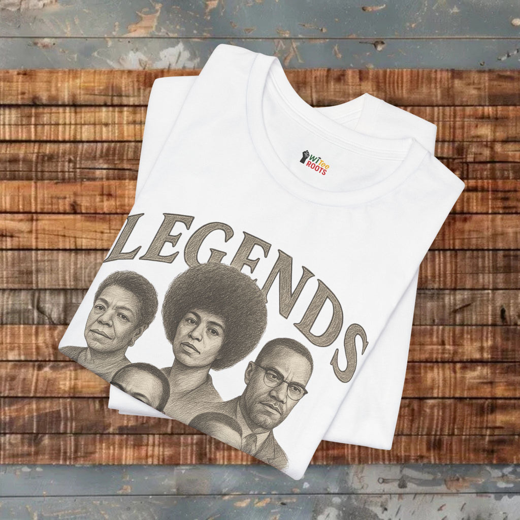 White t-shirt with 'LEGENDS' graphic on a wooden surface