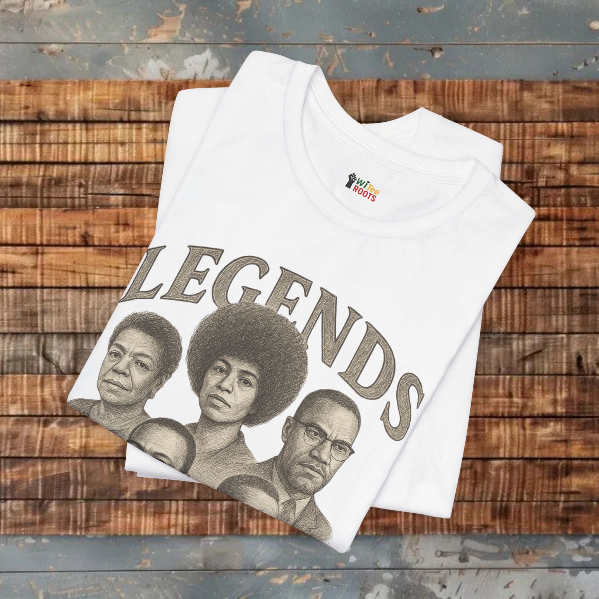 White t-shirt with 'LEGENDS' graphic on a wooden surface