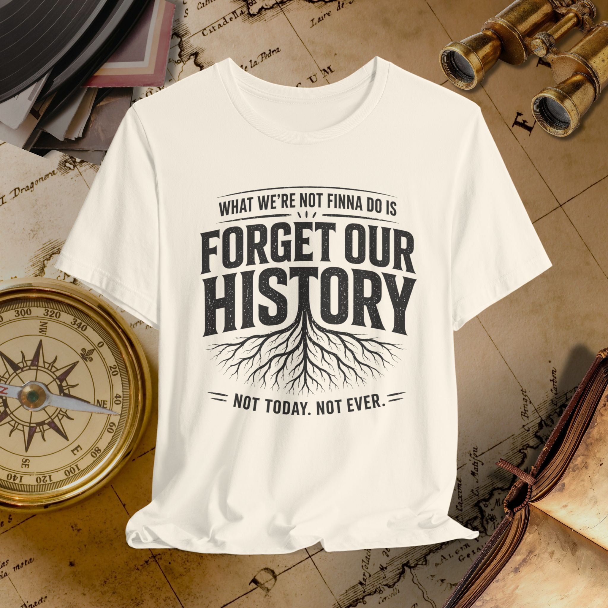 Beige t-shirt with 'Forget Our History' text on a vintage map background
