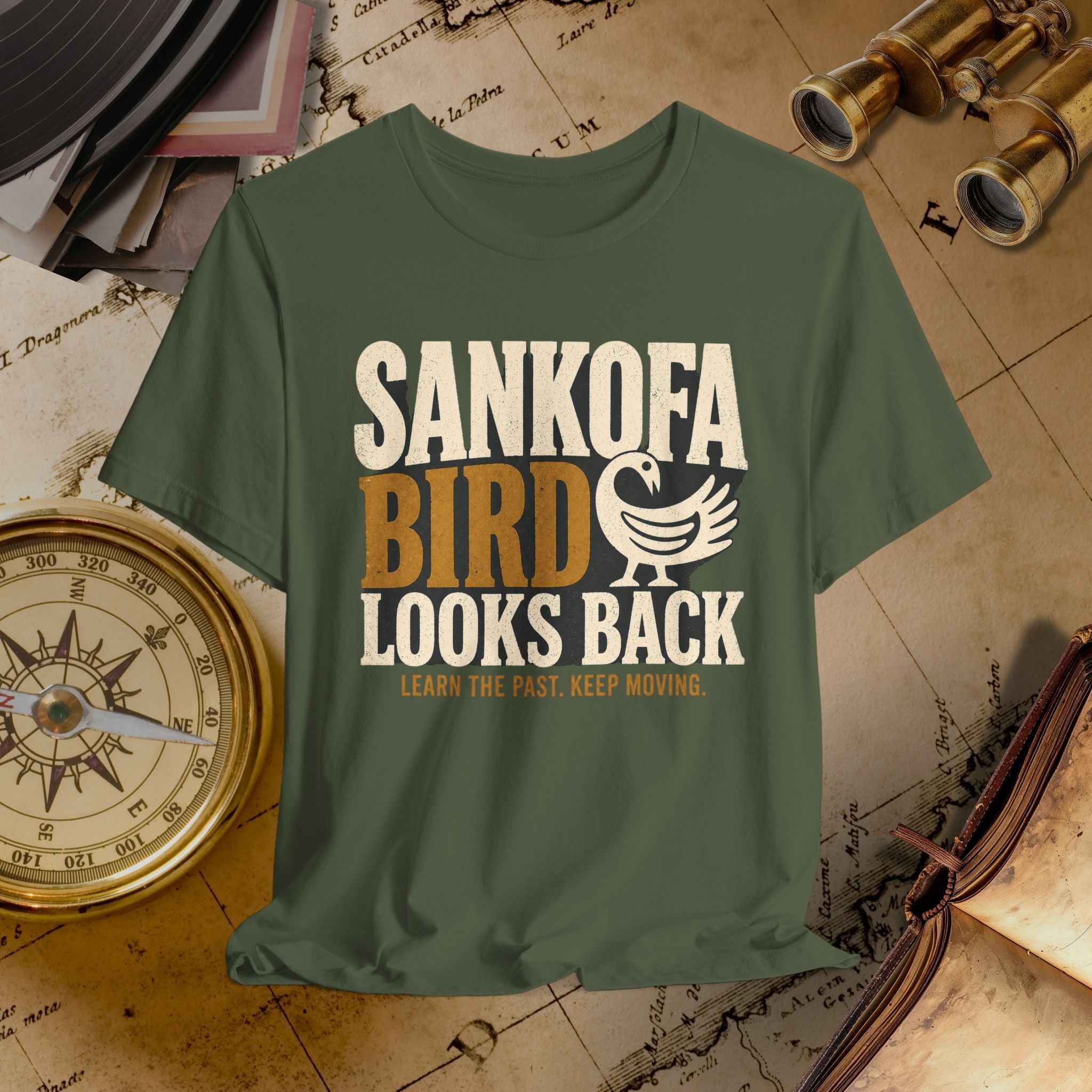 Green t-shirt with 'SANKOFA BIRD' text on a vintage map background