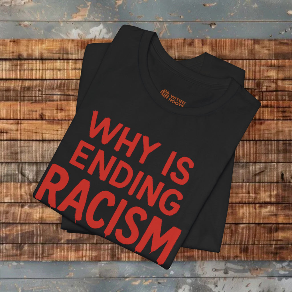 Black t-shirt with red text 'WHY IS ENDING RACISM' on a wooden surface