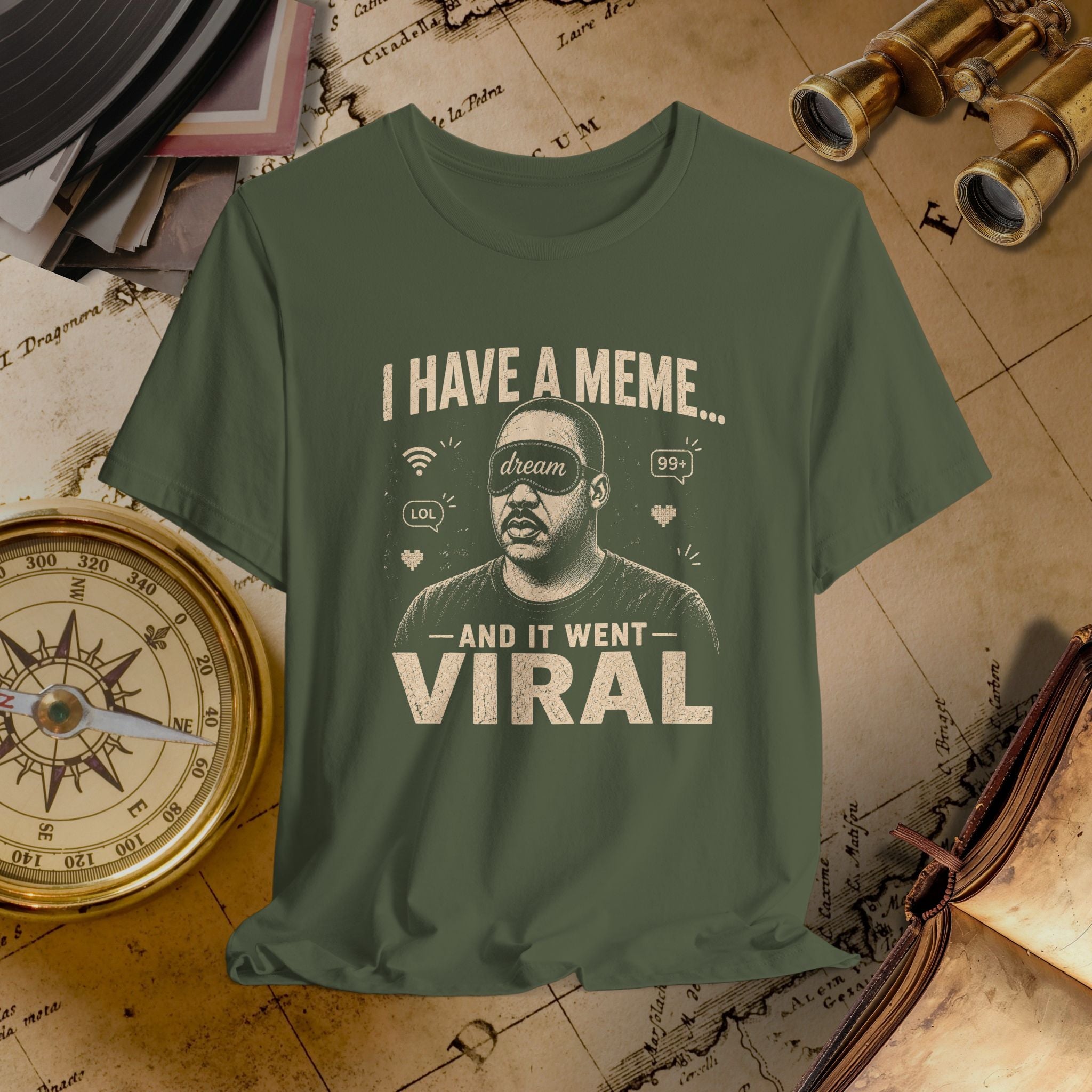 Green t-shirt with graphic and text on a vintage map background